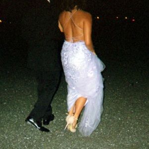 Purple prom dress with a train